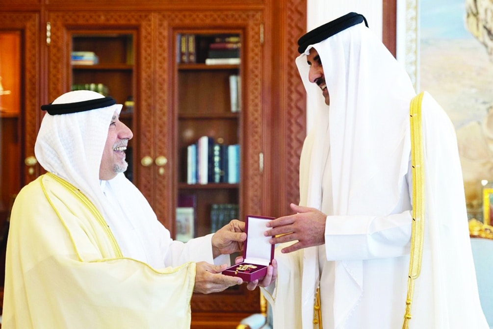 Qatar's Amir Sheikh Tamim bin Hamad Al-Thani grants Al-Wajbah Decoration to the Kuwaiti Ambassador to Qatar Hafeez Mohammad Al-Ajmi